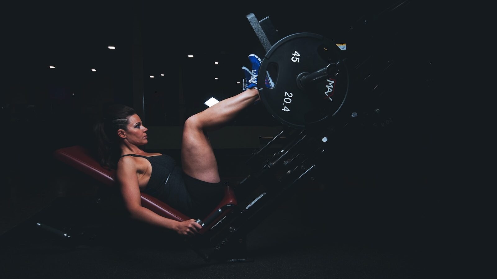 woman on gym equipment